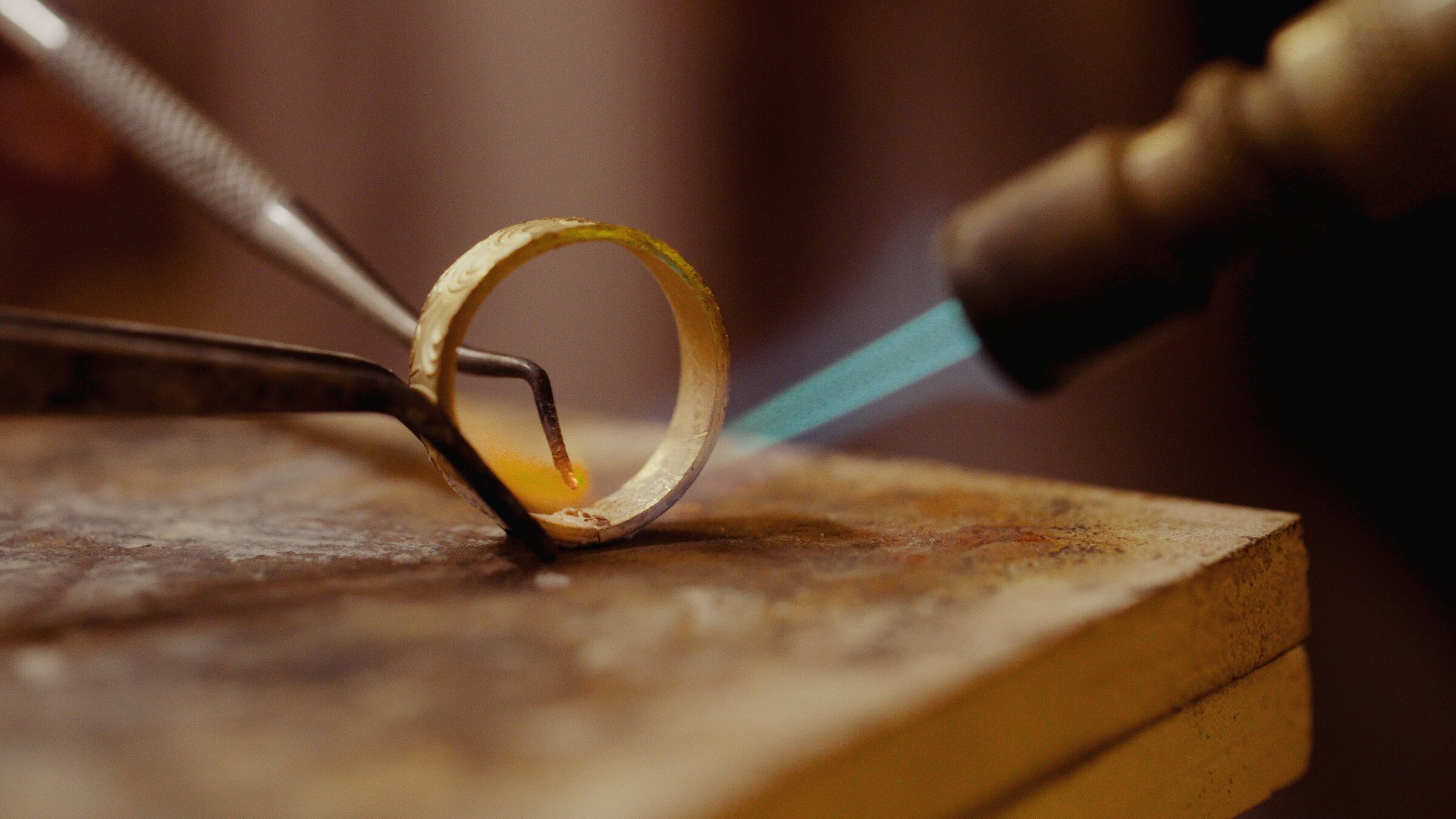 Selecting a ring from a tray at the bench