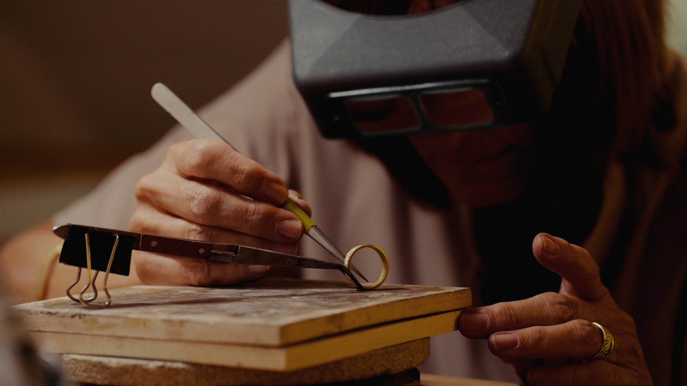 Sizing a ring at the jeweller's workbench