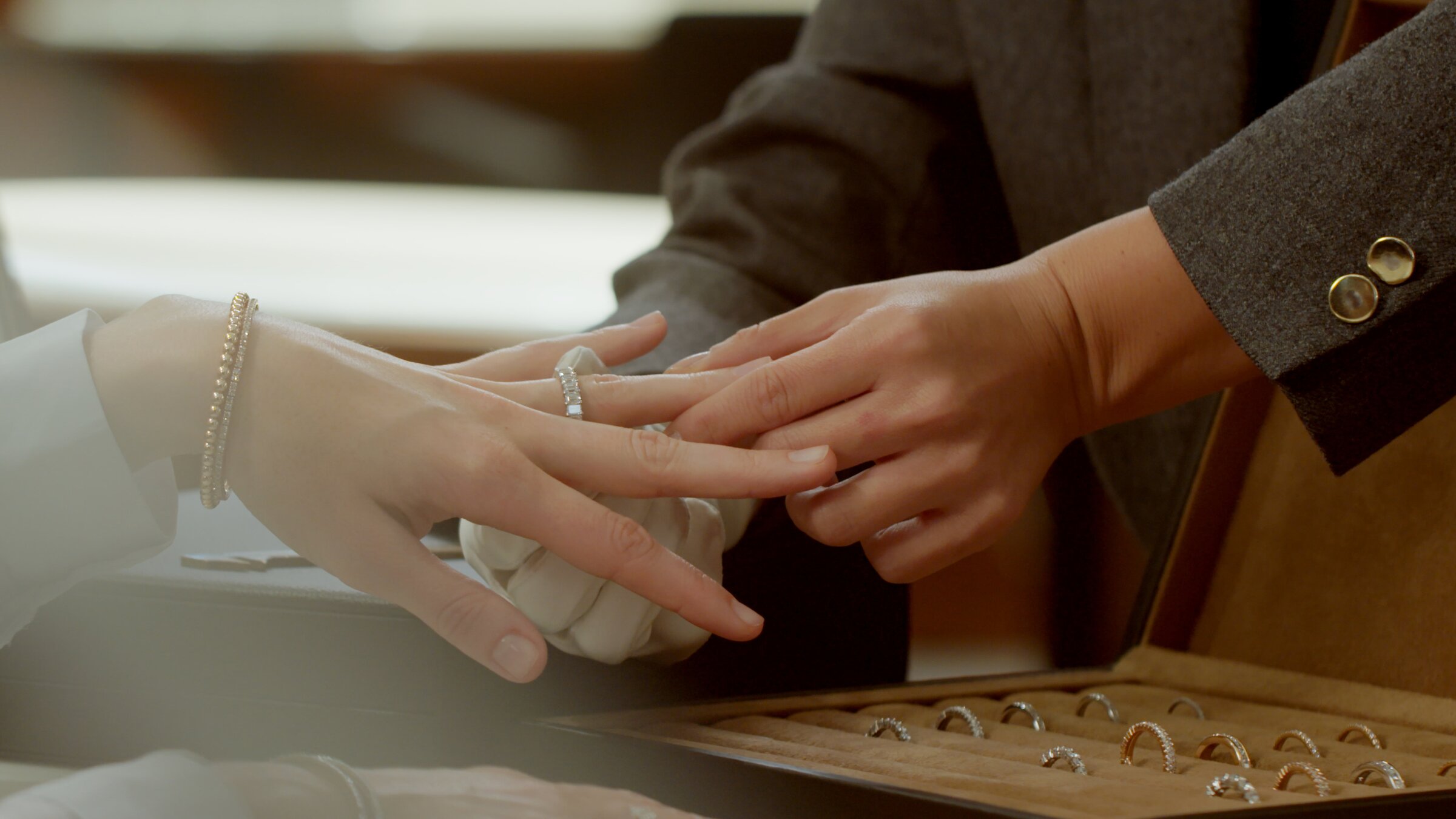 Maison De Greef counter, client trying on a diamond ring